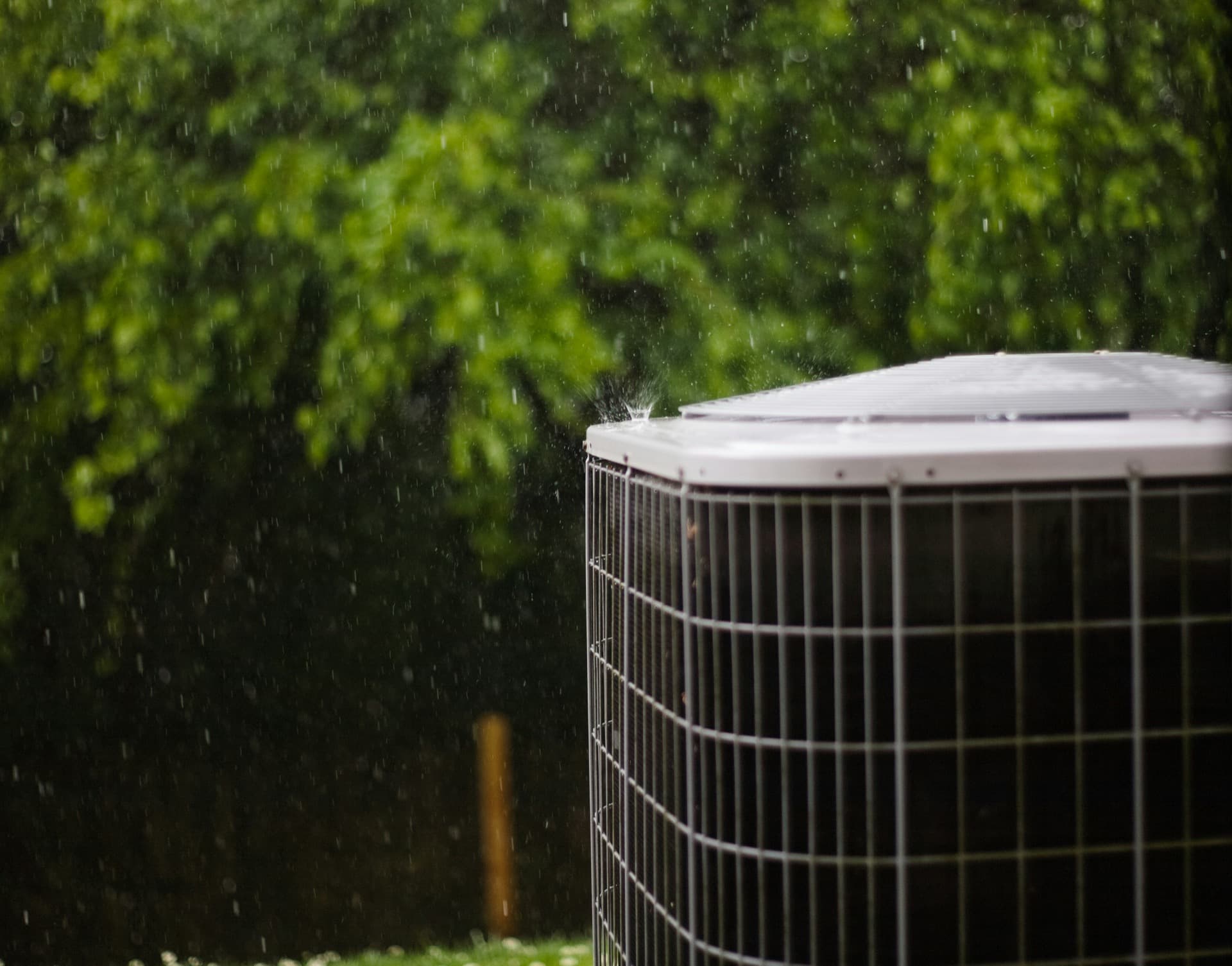 Outdoor air conditioning condenser in the rain